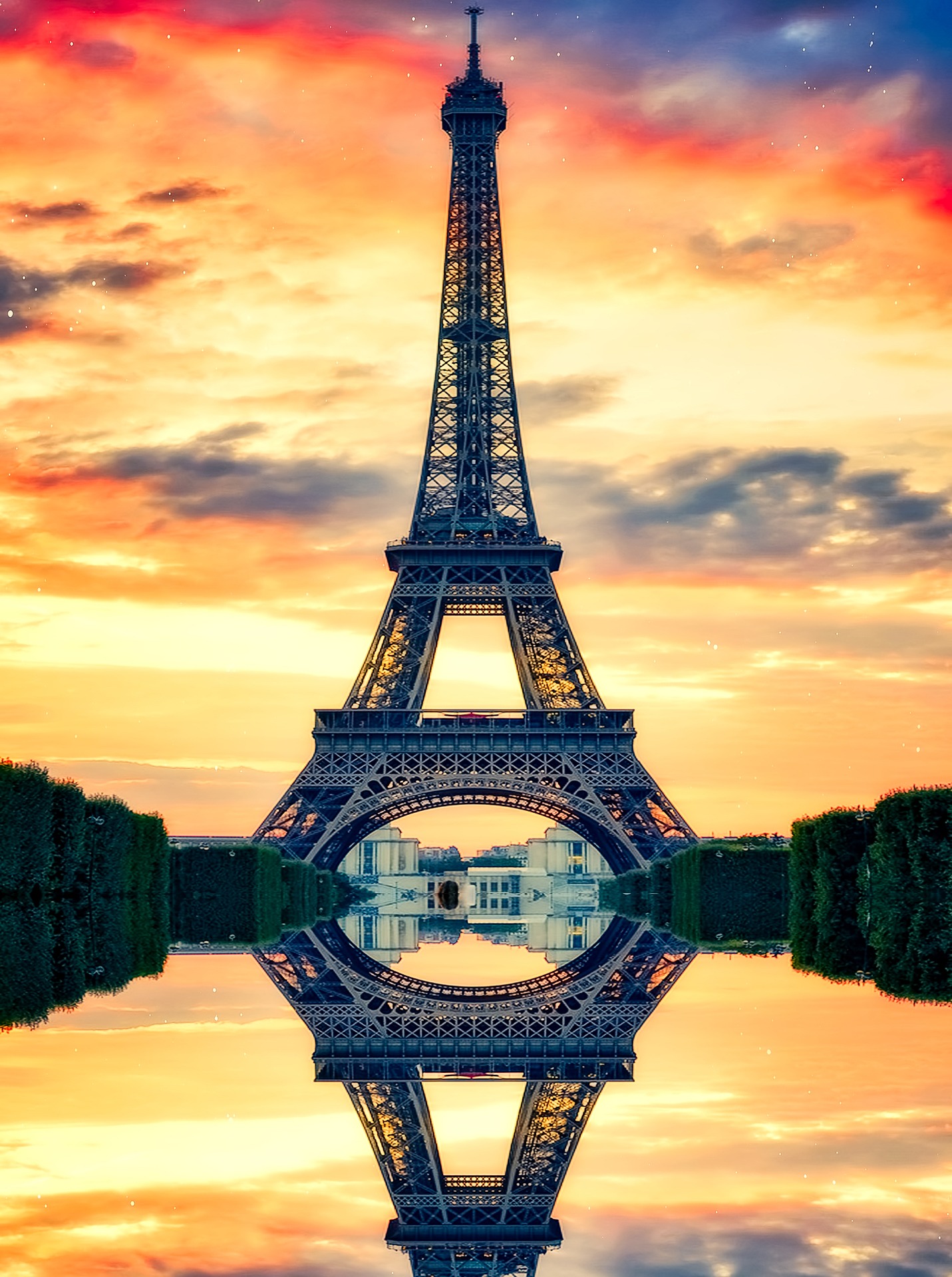 Eiffel Tower lit by an orange sunset