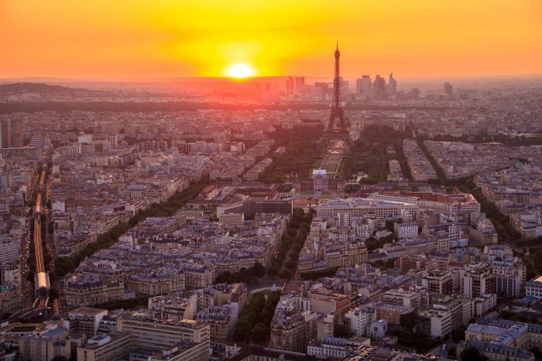 Eiffel Tower lit by sunset