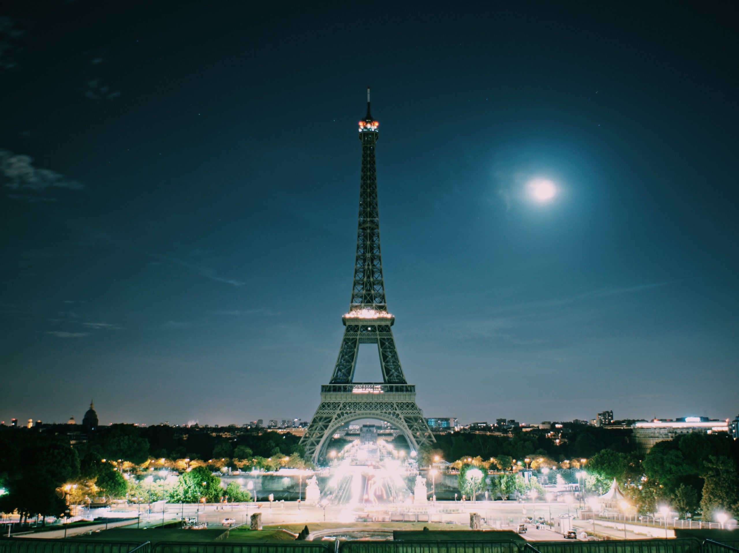 Eiffel Tower at night with spot lights